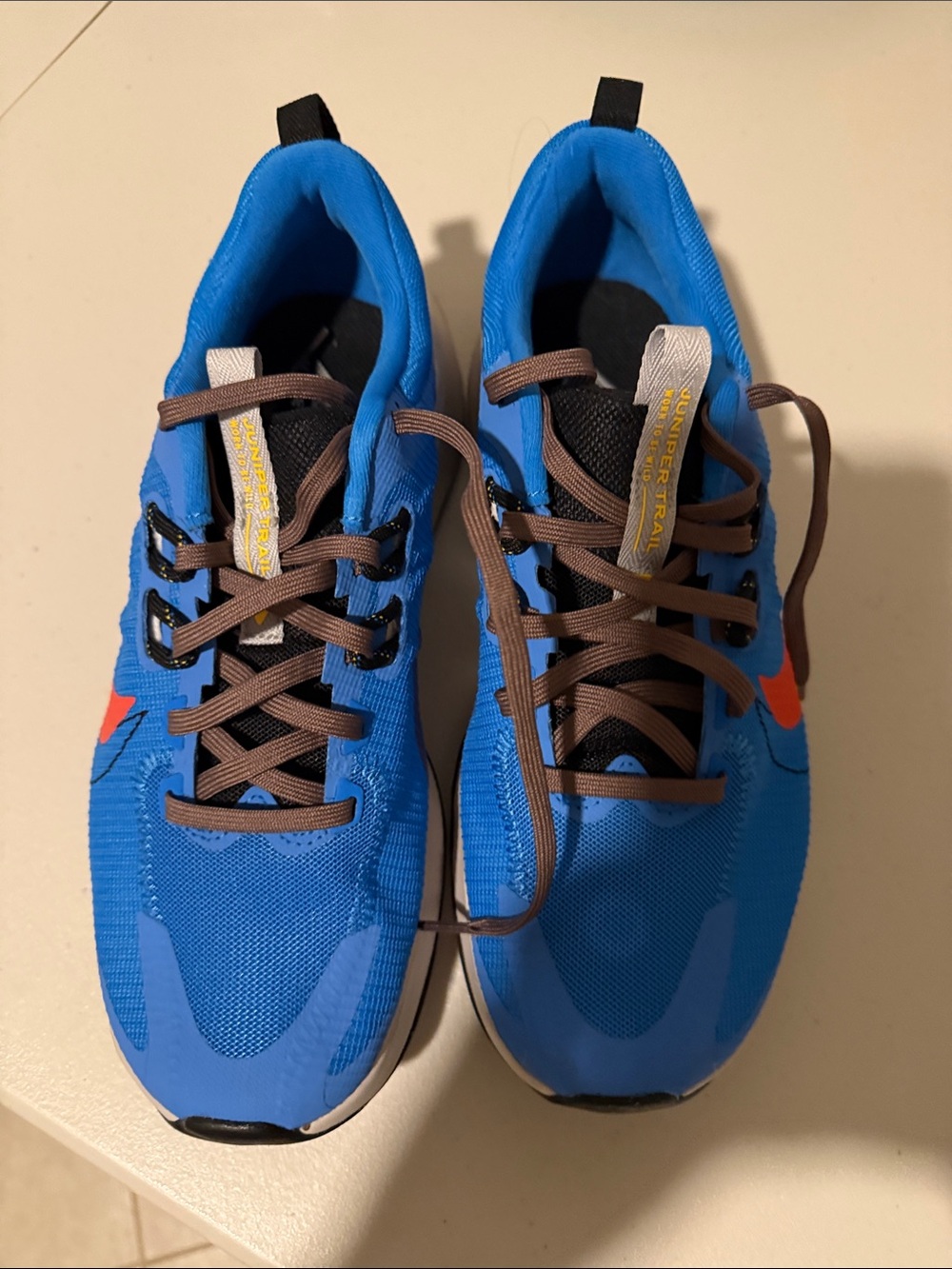 Nike men’s Blue Sneakers with Orange Swoosh